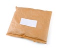 Small paper post parcel with blank label Royalty Free Stock Photo
