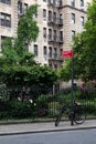 Small Park along a Street in Greenwich Village with an Old Apartment Building in New York City Royalty Free Stock Photo