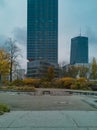 Small park in city center in front of two high corporate skyscrapers