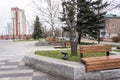 A small Park with wooden benches for citizens to relax Royalty Free Stock Photo