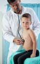 Small patient sitting on examination couch