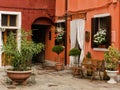 Small patio of the brightly painted houses in Burano, Italy