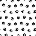 Small paw seamless pattern. Repeating cartoon black dog or cat on white background. Repeated marks pet texture for design prints.