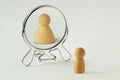 Small pawn looking in the mirror and seeing itself fat - Concept of dysmorphobia, anorexia, distorted self-image