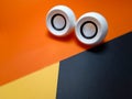 small pc white speaker on yellow withe orange and black background isolated Royalty Free Stock Photo