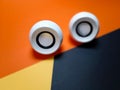 small pc white speaker on yellow withe orange and black background isolated Royalty Free Stock Photo