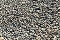 Small pebbles pattern on the beach.Stone background Royalty Free Stock Photo