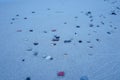 Small pebbles on a sandy beach. Royalty Free Stock Photo