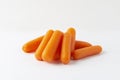 Small peeled pieces of carrot on white background