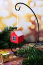 Small pendant in the form of a red house. A gift for the New Year and Christmas Royalty Free Stock Photo