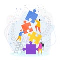 Small people put the pieces of the puzzle together. Royalty Free Stock Photo