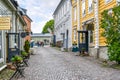 A small, picturesque, and colorful cobblestone street of shops and cafes in the medieval village of Porvoo, Finland