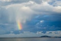 Small piece of Rainbow Over Sea Against cloudy Sky Royalty Free Stock Photo