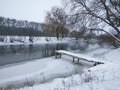 A small pier on the banks of the river. Snow. Winter landscape. Ukraine. South bug river Royalty Free Stock Photo