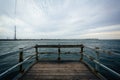 Small pier in the Indian River, near Bethany Beach, Delaware. Royalty Free Stock Photo