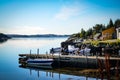 small pier at a norwegian fjord with perfect clear water Royalty Free Stock Photo