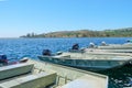 Lake with mall pier with small motor boat