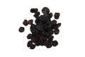 Small pile of black raisins on a white backgr