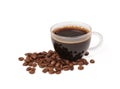 Small pile of coffee beans next to a freshly brewed cup of black coffee Royalty Free Stock Photo