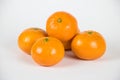 Small Pile of Fresh Ripe Clementines on White