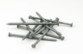 A small pile of galvanized, zinc plated sixteen penny nails
