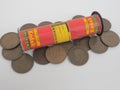 Small pile of large copper cents and a vintage film roll