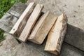 A small pile of logs of firewood on a bench in the garden. Close-up Royalty Free Stock Photo