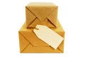 Small pile of mail packages, blank manila address label, isolated
