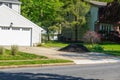 A small pile of mulch located in a residential driveway