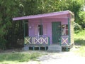 Small pink mauve wooden shop, Norman Manley Boulevard, Negril, Westmoreland, Jamaica Caribbean West Indies