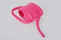 Small pink plastic watering can isolated Royalty Free Stock Photo