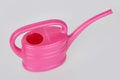 Small pink plastic watering can isolated Royalty Free Stock Photo