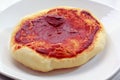 Small pizza (pizzette) on plate Royalty Free Stock Photo