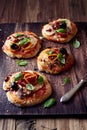 Small pizzas with mozzarella, salami and mushrooms Royalty Free Stock Photo