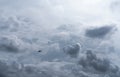 Small plane in cloudy sky for rainmaking. White fluffy clouds with small aircraft to make artificial rainfall. Two airplane flying Royalty Free Stock Photo