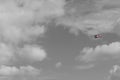 small plane doing pirouettes in the cloudy sky Royalty Free Stock Photo