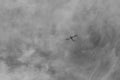 small plane doing pirouettes in the cloudy sky Royalty Free Stock Photo