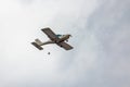 A small plane flies in the sky Royalty Free Stock Photo