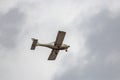 A small plane flies in the sky Royalty Free Stock Photo