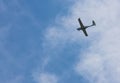 small plane flying low in the sky with space for text Royalty Free Stock Photo