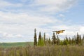 Small plane flying over Alaska