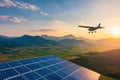 small plane flying over solar panels at sunset surrounded by mountains and fields showcases harmony between technology and Royalty Free Stock Photo