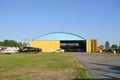 Small plane on the runway, airplane barn Royalty Free Stock Photo