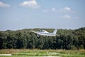 Small plane on runway takes off Royalty Free Stock Photo