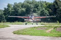 Small plane on runway takes off Royalty Free Stock Photo