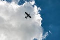 Small plane silhouette in cloudy sky Royalty Free Stock Photo