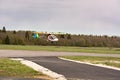 Chick the plane flies over the runway Royalty Free Stock Photo