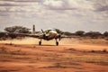 A small plane successfully makes a landing on a dirt road, demonstrating precise control and skill, Small prop plane landing on a Royalty Free Stock Photo