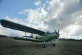 Small plane takes off from field Royalty Free Stock Photo