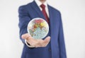 Planet Earth political globe in politician or businessman hand